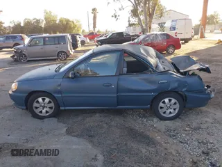 2002 Kia Rio with VIN KNADC123826128733, listed as a IAAI auction lot 41643123 with 101,433 mi miles. Bid and sale history available at carsss.com. Image 14.