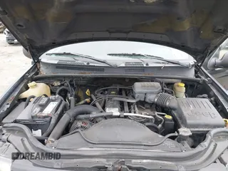 2004 Jeep Grand Cherokee Laredo z VIN 1J4GW48S54C198115, wystawiony jako IAAI lot #42351240 z przebiegiem 189 416 mil mil oraz . Historia ofert i sprzedaży dostępna na DreamBid. Obrazek 10.