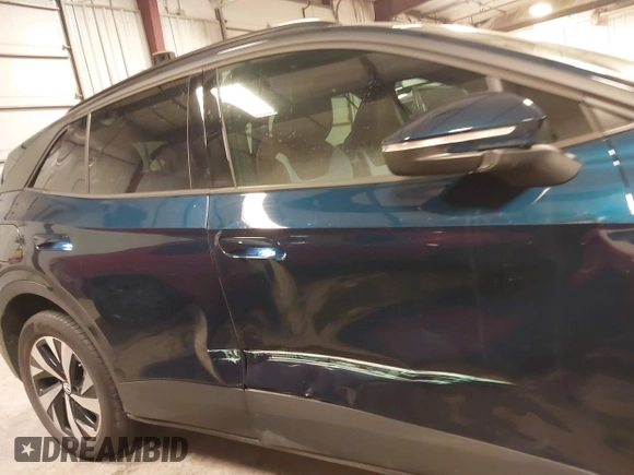 2023 Volkswagen ID.4 Pro z VIN 1V2DNPE84PC038042, wystawiony jako IAAI lot #41446269 z przebiegiem 12 878 mil mil oraz . Historia ofert i sprzedaży dostępna na DreamBid. Obrazek 14.