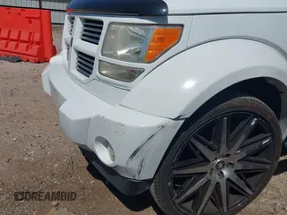 2011 Dodge Nitro Heat with VIN 1D4PT4GX9BW587284, listed as a IAAI auction lot 41998357 with 100,366 mi miles and . Bid and sale history available at DreamBid. Image 6.