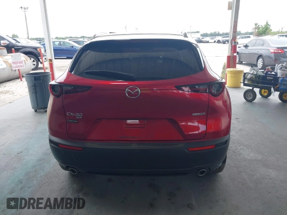 2023 Mazda CX-30 S Carbon Edition with VIN 3MVDMBCM3PM537841, listed as a IAAI auction lot 42080487 with 22,718 mi miles and . Bid and sale history available at DreamBid. Image 17.
