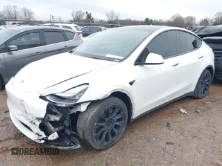 2021 Tesla Model Y Standard Range with VIN 5YJYGDED8MF114076, listed as a IAAI auction lot 41567295 with 150,133 mi miles and . Bid and sale history available at DreamBid. Image 16.