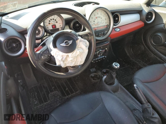 2013 MINI Convertible with VIN WMWZN3C58DT265980, listed as a Copart auction lot 77157154 with 88,975 mi miles and Salvage title. Bid and sale history available at DreamBid. Image 8.