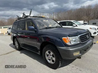 2002 Toyota Land Cruiser z VIN JTEHT05J622022972, wystawiony jako Copart lot #54529135 z przebiegiem 299 548 mil mil oraz Czysty tytuł • Clean title. Historia ofert i sprzedaży dostępna na DreamBid. Obrazek 1.