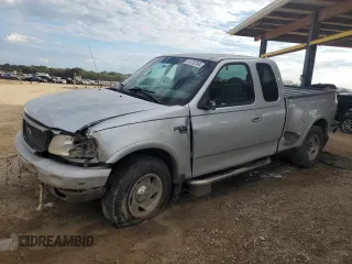 2000 Ford F-150 XL with VIN 1FTRX08L4YKB06288, listed as a Copart auction lot 74118744 with 244,985 mi miles and Salvage title. Bid and sale history available at DreamBid. Image 1.
