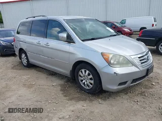 2010 Honda Odyssey EX z VIN 5FNRL3H49AB023447, wystawiony jako IAAI lot #42185412 z przebiegiem 215 317 mil mil oraz . Historia ofert i sprzedaży dostępna na DreamBid. Obrazek 1.