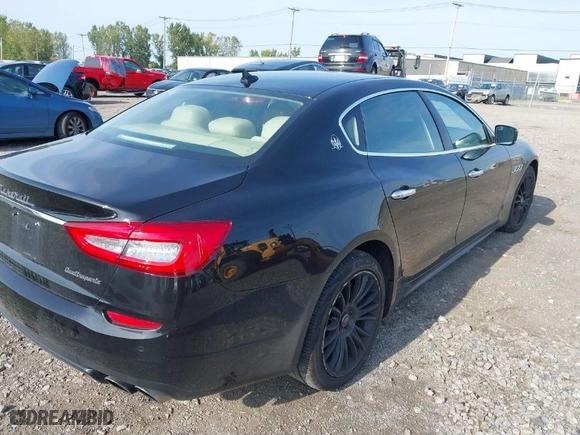 2014 Maserati Quattroporte S Q4 with VIN ZAM56RRA5E1113783, listed as a IAAI auction lot 40497812 with 100,036 mi miles. Bid and sale history available at carsss.com. Image 4.