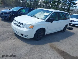 2010 Dodge Grand Caravan SE with VIN 2D4RN4DE0AR107498, listed as a IAAI auction lot 42048596 with 242,643 mi miles. Bid and sale history available at carsss.com. Image 2.