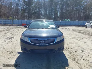 2009 Kia Optima LX with VIN KNAGE228895356661, listed as a IAAI auction lot 41821857 with 124,692 mi miles. Bid and sale history available at carsss.com. Image 13.
