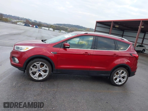 2019 Ford Escape Titanium z VIN 1FMCU9J99KUA18880, wystawiony jako IAAI lot #40830436 z przebiegiem 117 499 mil mil oraz . Historia ofert i sprzedaży dostępna na DreamBid. Obrazek 14.