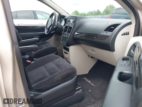 2014 Dodge Grand Caravan American Value with VIN 2C4RDGBGXER197092, listed as a IAAI auction lot 40020177 with 25,192 mi miles and . Bid and sale history available at DreamBid. Image 5.