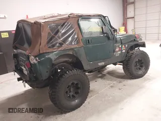 2000 Jeep Wrangler Sahara with VIN 1J4FA59S4YP788741, listed as a IAAI auction lot 41427876 with 209,434 mi miles. Bid and sale history available at carsss.com. Image 4.