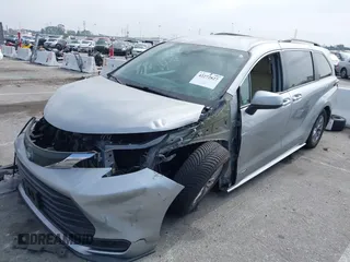 2021 Toyota Sienna LE with VIN 5TDKRKEC5MS010782, listed as a IAAI auction lot 42272827 with 196,844 mi miles and . Bid and sale history available at DreamBid. Image 2.