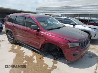 2017 Jeep Grand Cherokee Trailhawk with VIN 1C4RJFLG3HC699828, listed as a IAAI auction lot 42135444 with 98,596 mi miles and . Bid and sale history available at DreamBid. Image 1.