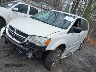 2012 Dodge Grand Caravan SE with VIN 2C4RDGBG9CR232038, listed as a IAAI auction lot 41823766 with 77,468 mi miles and . Bid and sale history available at DreamBid. Image 2.
