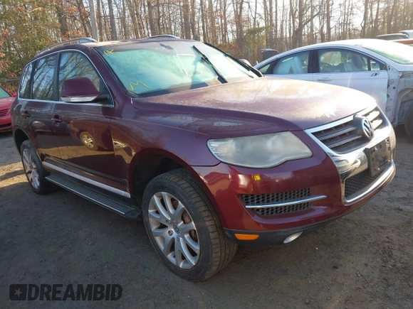 2008 Volkswagen Touareg V6 z VIN WVGBE77L38D044092, wystawiony jako IAAI lot #41766743 z przebiegiem Nie podano mil oraz . Historia ofert i sprzedaży dostępna na DreamBid. Obrazek 1.