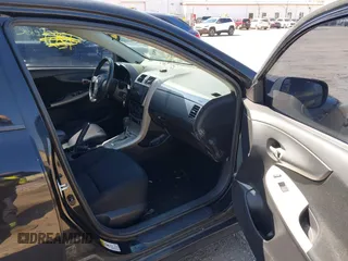 2010 Toyota Corolla with VIN 2T1BU4EE4AC415189, listed as a IAAI auction lot 42054548 with 194,011 mi miles. Bid and sale history available at carsss.com. Image 5.