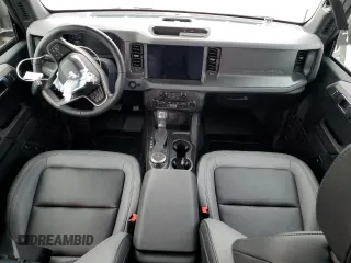 2024 Ford Bronco Big Bend z VIN 1FMDE7BH8RLA55673, wystawiony jako Copart lot #83586694 z przebiegiem 2629 mil mil oraz Szkody całkowita. Historia ofert i sprzedaży dostępna na DreamBid. Obrazek 8.