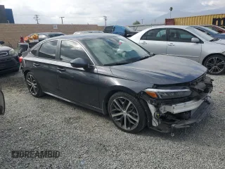 2024 Honda Civic Touring z VIN 2HGFE1F98RH336464, wystawiony jako Copart lot #50504775 z przebiegiem 14 655 mil mil oraz Szkoda całkowita • Salvage title. Historia ofert i sprzedaży dostępna na DreamBid. Obrazek 4.
