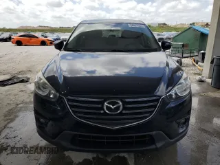 2016 Mazda CX-5 Touring with VIN JM3KE2CY9G0834048, listed as a Copart auction lot 54491535 with 116,328 mi miles and Salvage Title. Bid and sale history available at DreamBid. Image 5.