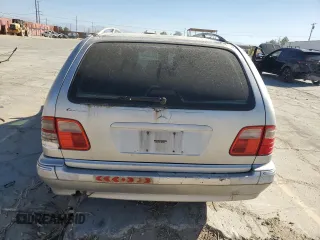 1999 Mercedes-Benz E-Class with VIN WDBJH65F7XA873728, listed as a Copart auction lot 71123304 with 0 mi miles and Salvage Title. Bid and sale history available at carsss.com. Image 6.