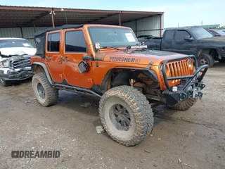 2011 Jeep Wrangler Unlimited Rubicon with VIN 1J4HA6H1XBL512229, listed as a IAAI auction lot 42160666 with 99,998 mi miles and . Bid and sale history available at DreamBid. Image 1.