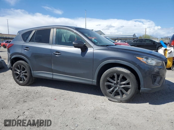 2015 Mazda CX-5 Grand Touring with VIN JM3KE4DY9F0536771, listed as a Copart auction lot 51801775 with 88,529 mi miles and Salvage Title. Bid and sale history available at DreamBid. Image 4.