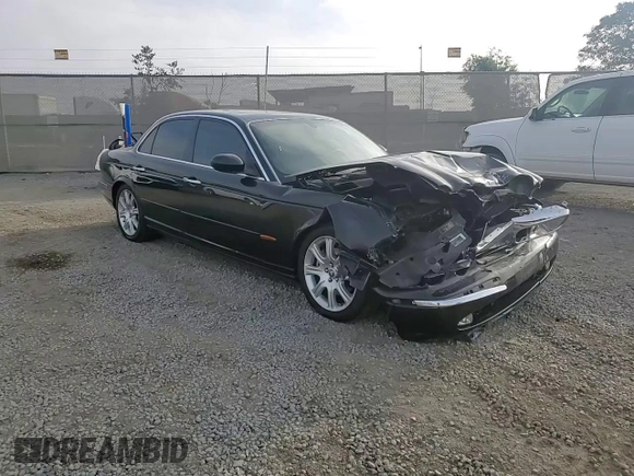 2004 Jaguar XJ with VIN SAJEA71C54SG01455, listed as a Copart auction lot 86591014 with 83,977 mi miles and Salvage Title. Bid and sale history available at carsss.com. Image 11.