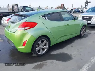 2012 Hyundai Veloster w/Gray Int z VIN KMHTC6AD3CU025315, wystawiony jako IAAI lot #42097741 z przebiegiem 146 726 mil mil oraz . Historia ofert i sprzedaży dostępna na DreamBid. Obrazek 4.