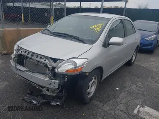 2009 Toyota Yaris with VIN JTDBT903694047246, listed as a IAAI auction lot 41961204 with 154,430 mi miles. Bid and sale history available at carsss.com. Image 2.