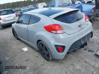 2014 Hyundai Veloster Turbo with VIN KMHTC6AE7EU199478, listed as a IAAI auction lot 41772626 with 162,985 mi miles. Bid and sale history available at carsss.com. Image 3.
