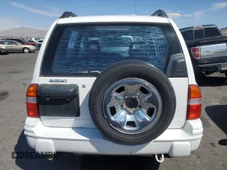 2003 Suzuki Vitara z VIN 2S3TE52V936103533, wystawiony jako Copart lot #55297135 z przebiegiem 122 230 mil mil oraz Szkody całkowita. Historia ofert i sprzedaży dostępna na DreamBid. Obrazek 6.
