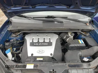 2006 Hyundai Tucson GLS with VIN KM8JN72D36U409525, listed as a IAAI auction lot 42082119 with 142,163 mi miles. Bid and sale history available at carsss.com. Image 10.