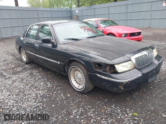 2002 Mercury Grand Marquis LS Premium z VIN 2MEFM75W42X644236, wystawiony jako IAAI lot #42276863 z przebiegiem 56 460 mil mil oraz . Historia ofert i sprzedaży dostępna na DreamBid. Obrazek 1.