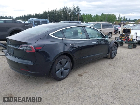 2019 Tesla Model 3 Mid Range with VIN 5YJ3E1EA6KF415656, listed as a IAAI auction lot 42140763 with 71,408 mi miles and . Bid and sale history available at carsss.com. Image 4.