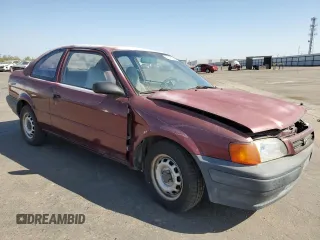 1996 Toyota Tercel DX z VIN JT2AC52L8T0124403, wystawiony jako Copart lot #66195834 z przebiegiem 137 467 mil mil oraz Szkody całkowita. Historia ofert i sprzedaży dostępna na DreamBid. Obrazek 4.