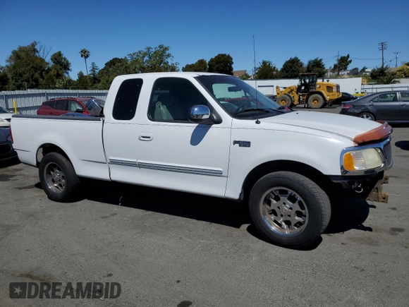 2002 Ford F-150 XL with VIN 1FTRX17212NA28461, listed as a Copart auction lot 63710665 with 185,460 mi miles and Salvage title. Bid and sale history available at DreamBid. Image 4.