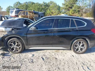 2019 BMW X1 sDrive28i with VIN WBXHU7C52K5L11560, listed as a IAAI auction lot 41354422 with 115,401 mi miles. Bid and sale history available at carsss.com. Image 14.