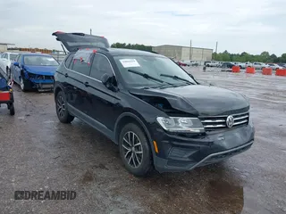 2021 Volkswagen Tiguan SE z VIN 3VV3B7AX7MM004286, wystawiony jako IAAI lot #39864219 z przebiegiem 67 429 mil mil oraz . Historia ofert i sprzedaży dostępna na DreamBid. Obrazek 1.