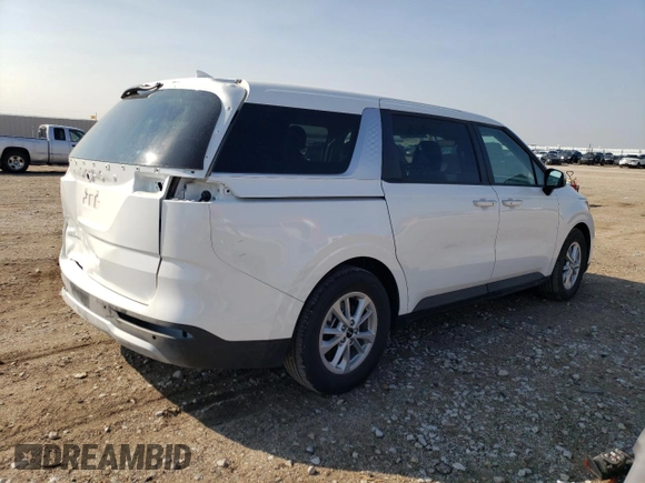 2023 Kia Carnival LX with VIN KNDNB4H35P6260181, listed as a Copart auction lot 74240714 with 6,879 mi miles and Salvage Title. Bid and sale history available at carsss.com. Image 3.