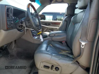2002 Cadillac Escalade z VIN 1GYEC63T42R189976, wystawiony jako Copart lot #57852565 z przebiegiem 243 089 mil mil oraz Szkody całkowita. Historia ofert i sprzedaży dostępna na DreamBid. Obrazek 7.