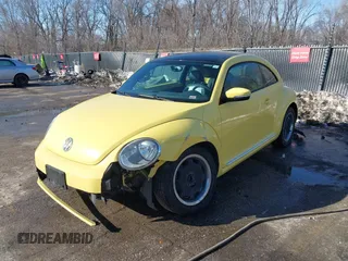 2012 Volkswagen Beetle 2.5L PZEV with VIN 3VWJP7AT9CM610530, listed as a IAAI auction lot 41388728 with 143,909 mi miles. Bid and sale history available at carsss.com. Image 2.