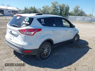 2016 Ford Escape SE with VIN 1FMCU9GX9GUC62462, listed as a IAAI auction lot 39999808 with Not Provided miles. Bid and sale history available at carsss.com. Image 4.