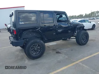 2014 Jeep Wrangler Unlimited Rubicon with VIN 1C4BJWFG0EL116026, listed as a IAAI auction lot 41729074 with 154,597 mi miles. Bid and sale history available at carsss.com. Image 4.