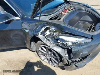 2019 Tesla Model 3 Mid Range with VIN 5YJ3E1EA3KF304286, listed as a IAAI auction lot 42066908 with 164,667 mi miles. Bid and sale history available at carsss.com. Image 6.