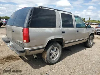 1999 Chevrolet Tahoe Z71 with VIN 1GNEK13R0XJ444734, listed as a Copart auction lot 76323384 with 160,631 mi miles and Salvage Title. Bid and sale history available at carsss.com. Image 3.