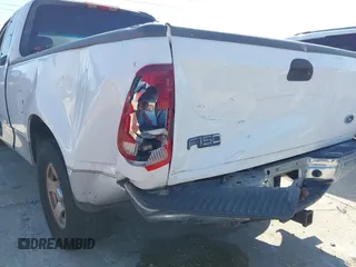 2002 Ford F-150 XL with VIN 1FTRX17WX2NA92467, listed as a IAAI auction lot 41977334 with 176,902 mi miles. Bid and sale history available at carsss.com. Image 6.