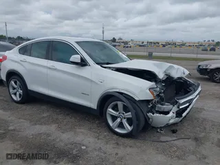 2015 BMW X4 xDrive28i with VIN 5UXXW3C55F0M87113, listed as a IAAI auction lot 41645810 with 148,179 mi miles. Bid and sale history available at carsss.com. Image 1.