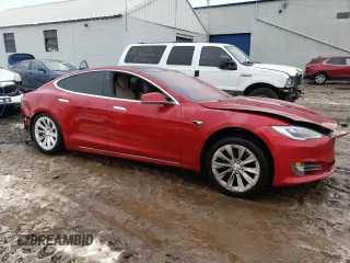 2017 Tesla Model S 100D with VIN 5YJSA1E29HF184387, listed as a Copart auction lot 39186144 with 101,387 mi miles and Salvage title. Bid and sale history available at DreamBid. Image 4.
