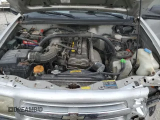 2002 Chevrolet Tracker z VIN 2CNBE13C926934704, wystawiony jako Copart lot #70717194 z przebiegiem 189 076 mil mil oraz Szkody całkowita. Historia ofert i sprzedaży dostępna na DreamBid. Obrazek 11.